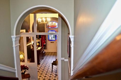 a hallway with an archway leading to a dining room at 23 St Mary's in York