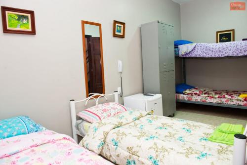Cama o camas de una habitación en Orange - Casa de Hóspedes - modelo Pousada
