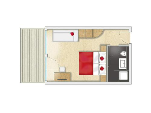 a floor plan of a room with a refrigerator at Alpinhotel Pacheiner in Treffen