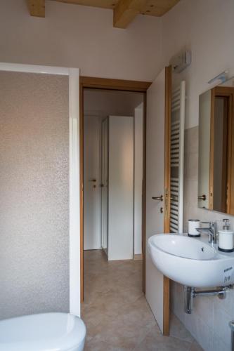 a bathroom with a sink and a toilet at Appartamento Il Fattore in Levanto
