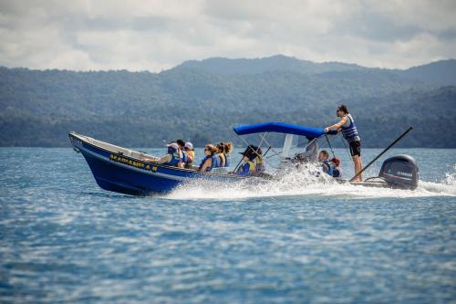 a group of people on a boat in the water at Hotel Costa Choco in Bahía Solano