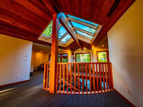an attic room with a skylight in a house at The Cabins at Terrace Beach in Ucluelet