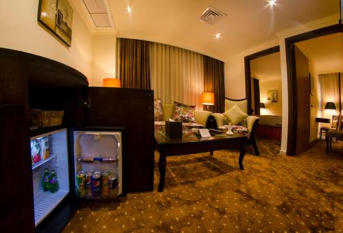 Un ou plusieurs lits dans un hébergement de l'établissement Meneur Hotel
