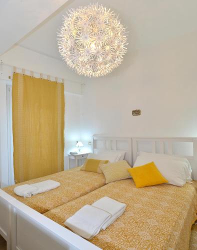 a bedroom with a large bed with towels on it at Fidanza House in Bagnoregio