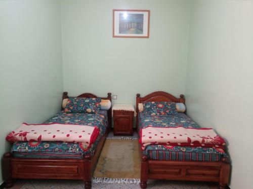 Posteľ alebo postele v izbe v ubytovaní HÔTEL BELLE VUE