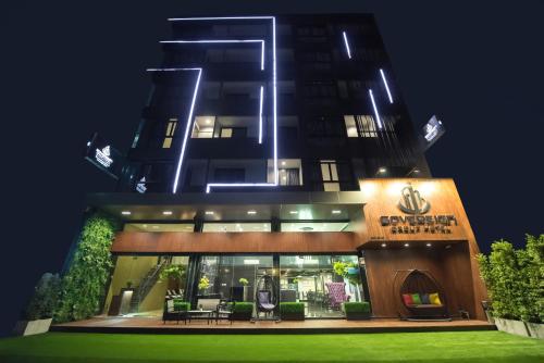 a building with a sign on the front of it at Sovereign Group Hotel at Pratunam in Bangkok
