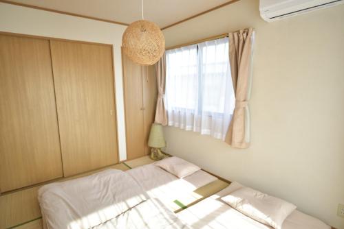 near to Miyajimaにあるベッド