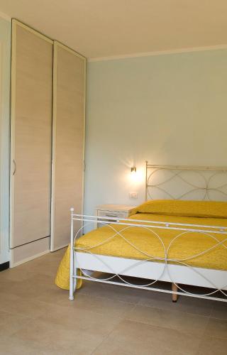 Ein Bett oder Betten in einem Zimmer der Unterkunft A Durmì