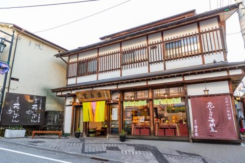 a building with a store front with at Hanaingen in Kusatsu
