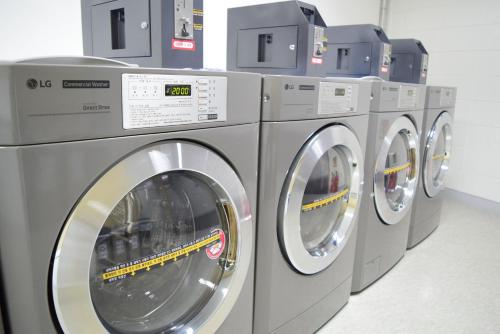 a row of washing machines in a laundrette at Nine Tree by Parnas Seoul Myeongdong 2 in Seoul
