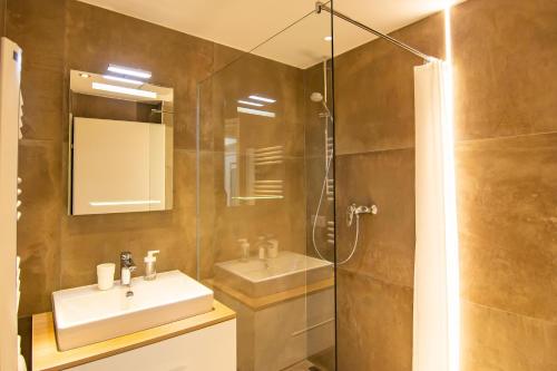 a bathroom with a sink and a shower at vista monte in Eben im Pongau