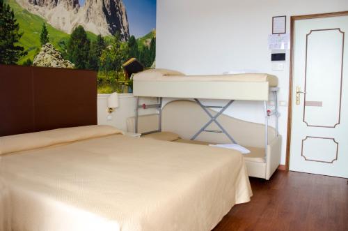 Postel nebo postele na pokoji v ubytování Hotel Apollo