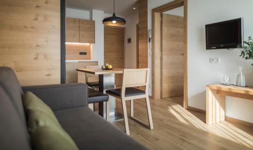 a living room with a couch and a table at Residence Margareth in Campo Tures