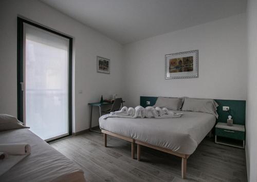 Postel nebo postele na pokoji v ubytování B & B Il sorriso