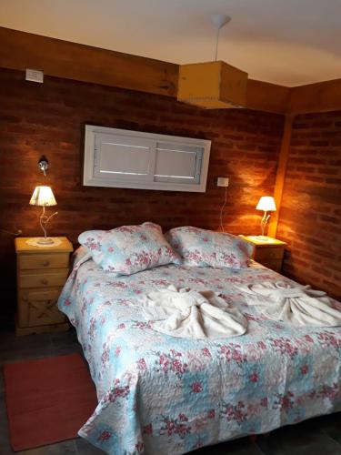 Postel nebo postele na pokoji v ubytování Apart hotel Pehuenia