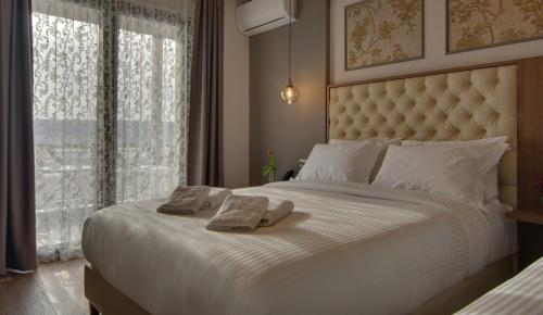 Letto o letti in una camera di La Suite Boutique Hotel & Spa
