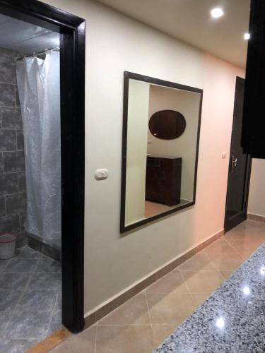 a mirror on a wall in a room at sea view apartment in Porto Marina hotel tower in El Alamein
