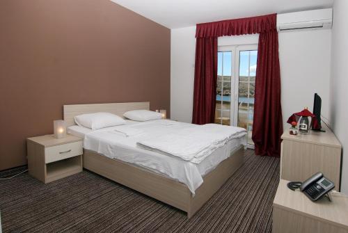 Postel nebo postele na pokoji v ubytování Hotel Belveder