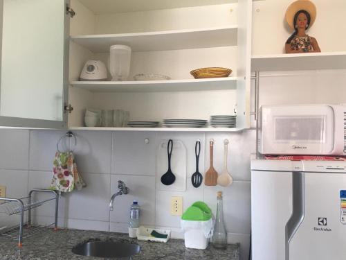Кухня или мини-кухня в Apartamento Praia de Pajucara
