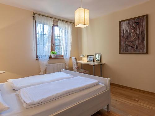 מיטה או מיטות בחדר ב-VacationClub - Osiedle Podgórze 1B Apartament 16