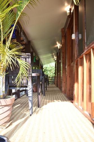 a hallway of a building with a table and plants at Club Palolem Resort in Palolem