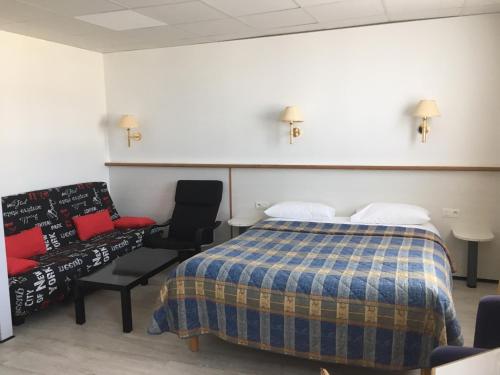 Cama ou camas em um quarto em Hotel De La Mer
