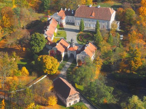 an aerial view of a large house in the forest at Pałac Galiny in Bartoszyce- Galiny