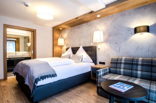 Postel nebo postele na pokoji v ubytování Hotel Garni Funtana