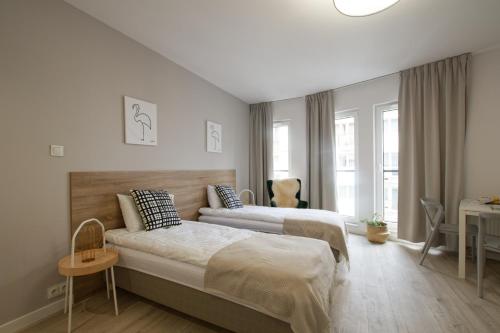 Posteľ alebo postele v izbe v ubytovaní Apple Green Apartments