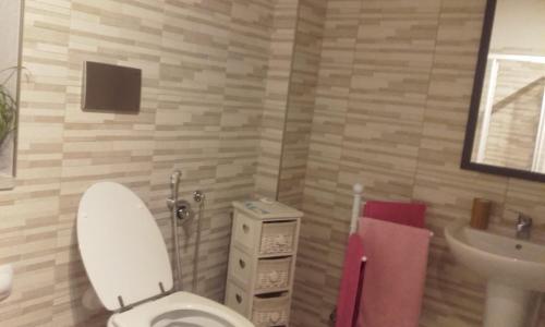 a bathroom with a white toilet and a sink at Bed and Breakfast Ca D'Pandin in Peveragno