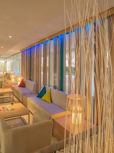 a living room with a couch and a window at JS Palma Stay - Adults Only in Can Pastilla
