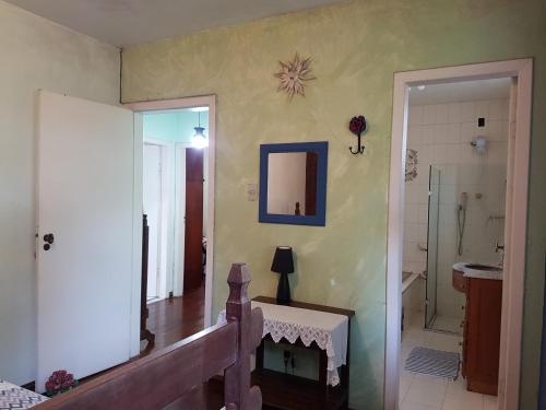 a room with a staircase and a mirror on the wall at Casa da Kau in Ouro Preto