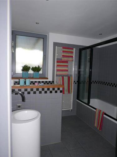 a bathroom with a sink and a window at Schwarzes Schaf in Kleve
