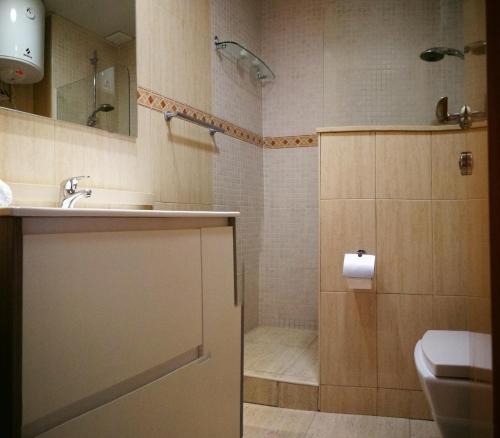 a bathroom with a sink and a toilet and a shower at White Stones Beach In Sant Pol de Mar in San Pol de Mar