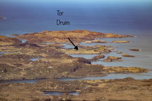 an island in the ocean with the words for durium at Tor Druim in Drumbeg