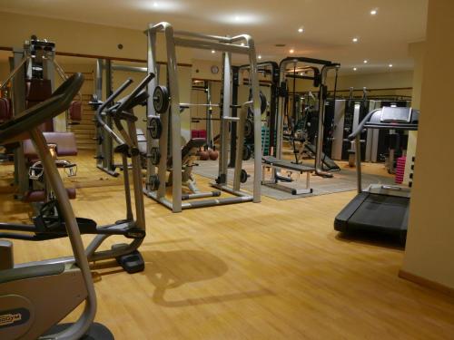 a gym with a bunch of tread machines at Odyssee Park Hotel in Agadir