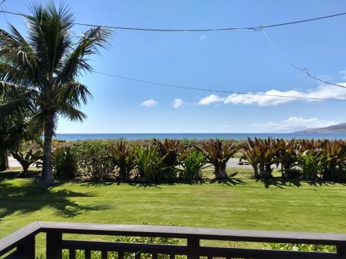 a view of the ocean from the balcony of a house at Nona Lani Cottages in Kihei