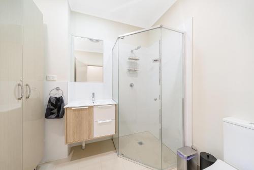 a bathroom with a shower and a sink at Marulan Stayz in Marulan
