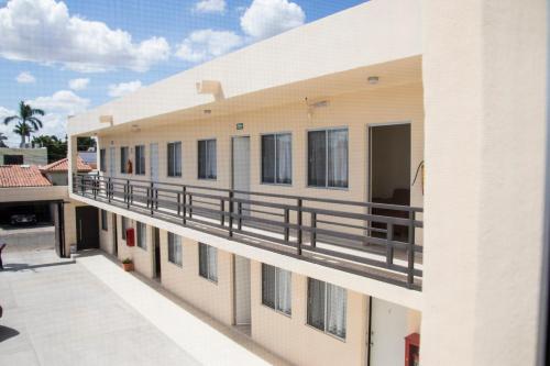anterior view of a building with a balcony at Hotel Nápoles in Ciudad Obregón