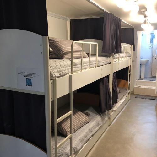 Ένα ή περισσότερα κρεβάτια σε δωμάτιο στο Jun Guesthouse