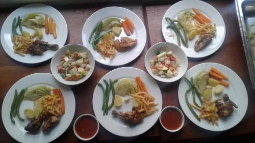 a group of plates of food on a table at Alta Vista in Ella