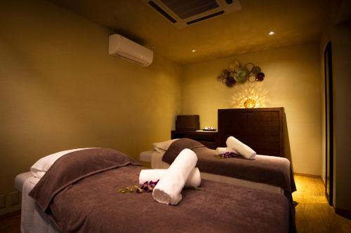 Ένα ή περισσότερα κρεβάτια σε δωμάτιο στο Hakone Elecasa Hotel and Spa