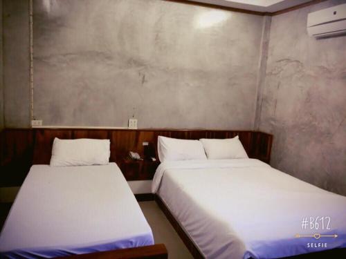 Ένα ή περισσότερα κρεβάτια σε δωμάτιο στο First Garden Home Resort