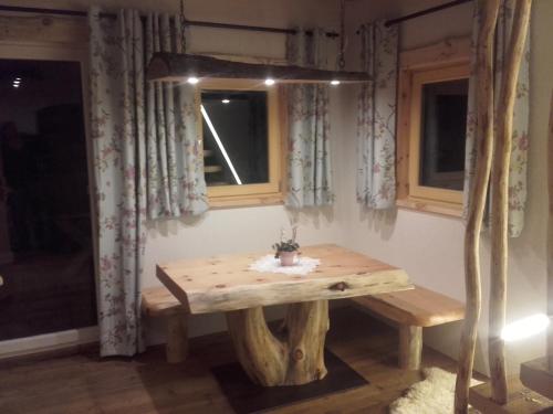a wooden table in a room with a window at Apartment Krobath in Murau