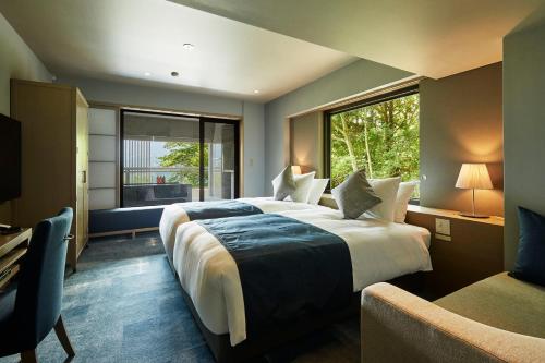 Ένα ή περισσότερα κρεβάτια σε δωμάτιο στο Hakone Elecasa Hotel and Spa
