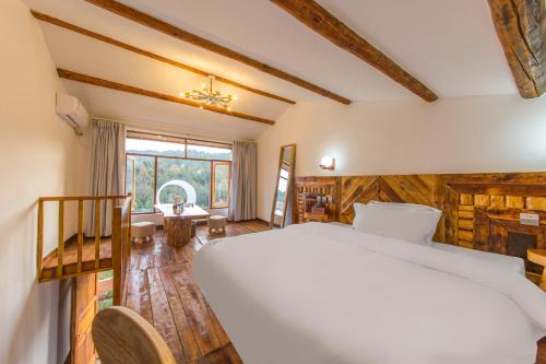 Postel nebo postele na pokoji v ubytování Chunjian Guesthouse