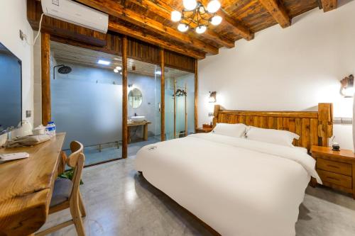 Postel nebo postele na pokoji v ubytování Chunjian Guesthouse