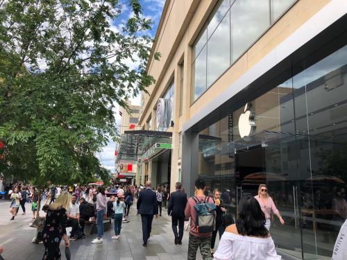 a crowd of people walking in front of a store at Lux 2BR Apt on Hindmarsh SQ-Pool-Gym-Sauna-Parking in Adelaide