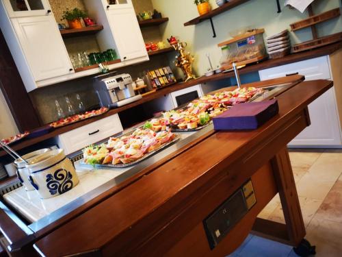 a buffet line with several trays of food on it at Hotel - Pension Scheiblechner in Göstling an der Ybbs