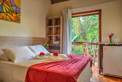 A bed or beds in a room at i9 Embaú Flats & Suites